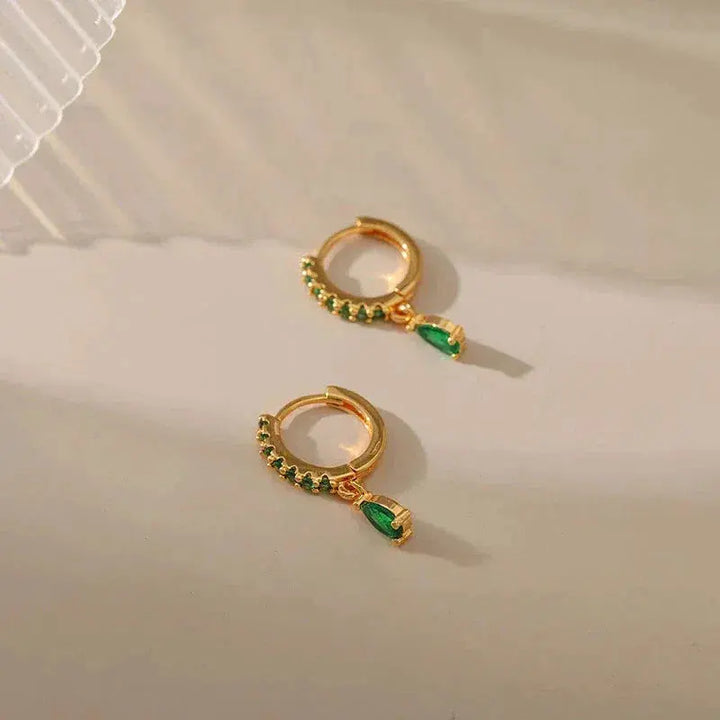 Zirconia earrings with emerald in gold
