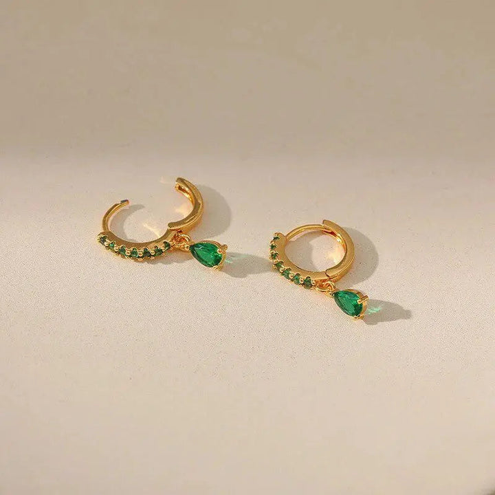 Zirconia earrings with emerald in gold