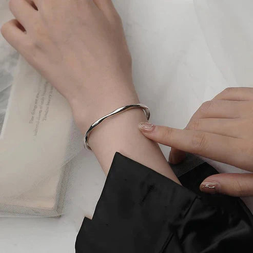 Silver bracelet, adjustable and irregular in shape